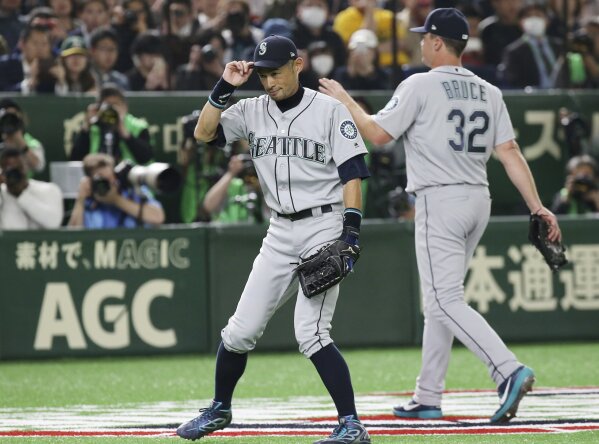 Ichiro cheered at Tokyo Dome, Mariners top A's 9-7 in opener | AP News
